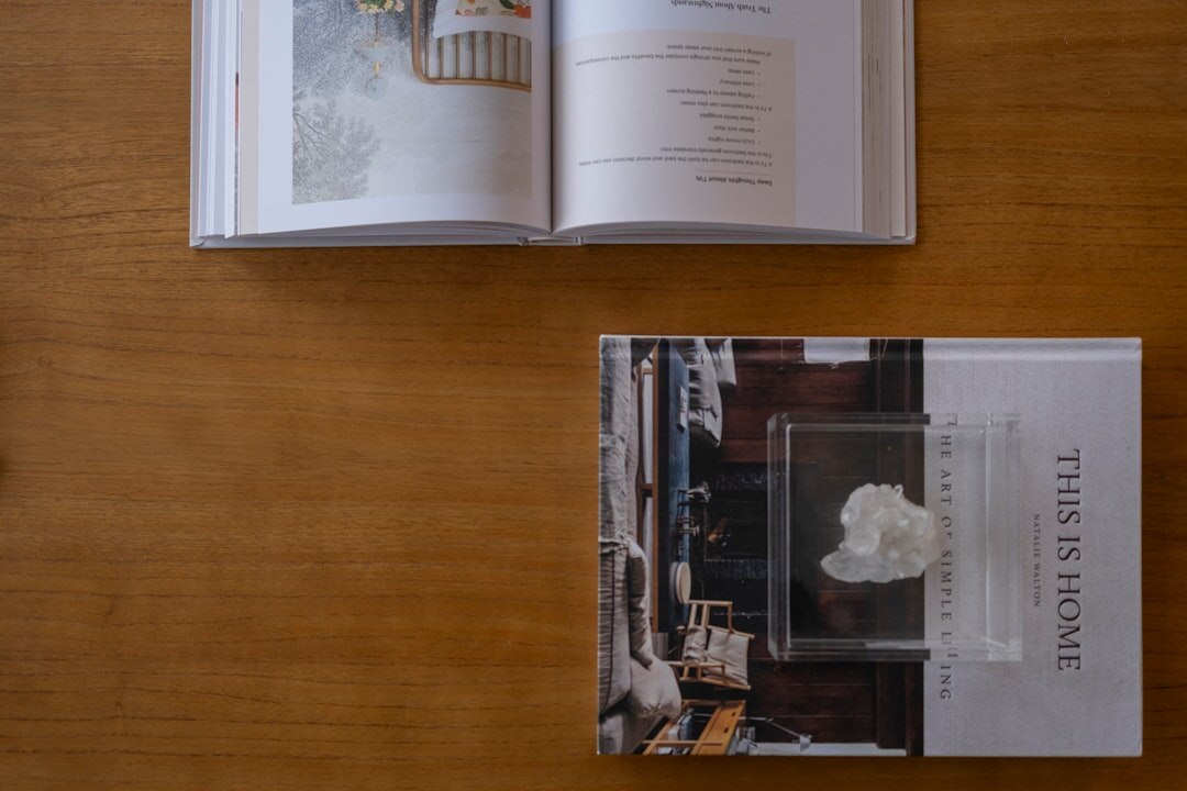 Archive of printed documentary photographs spread on a wooden table