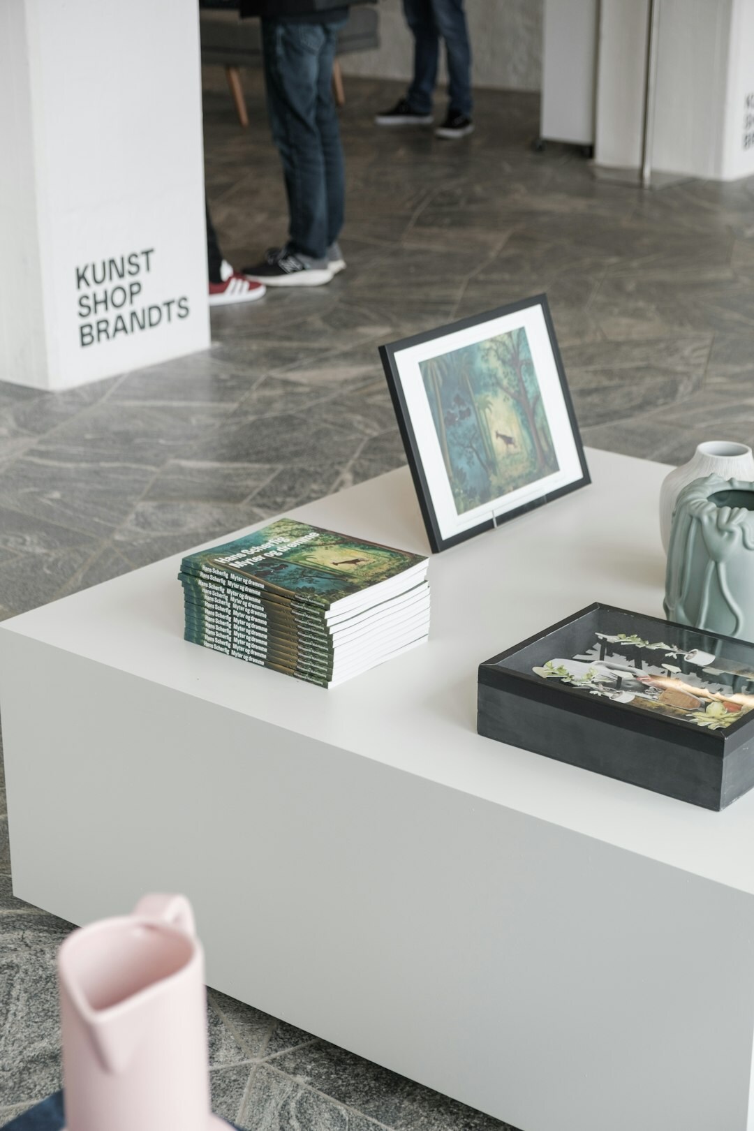 Small editorial team of Danish photographers and writers reviewing photo prints together