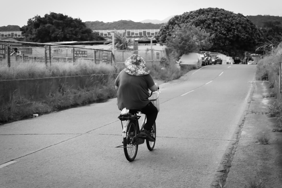 elderly woman on bicycle