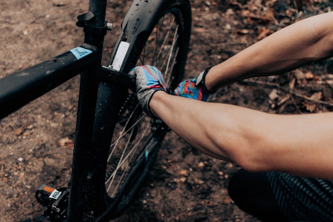 man repairing bicycle